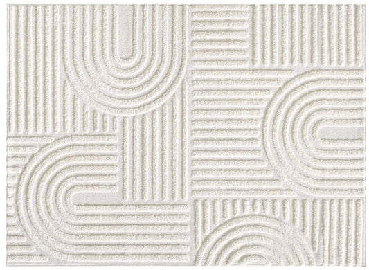Close-up of a white textured rug with a geometric pattern of raised arcs and parallel lines