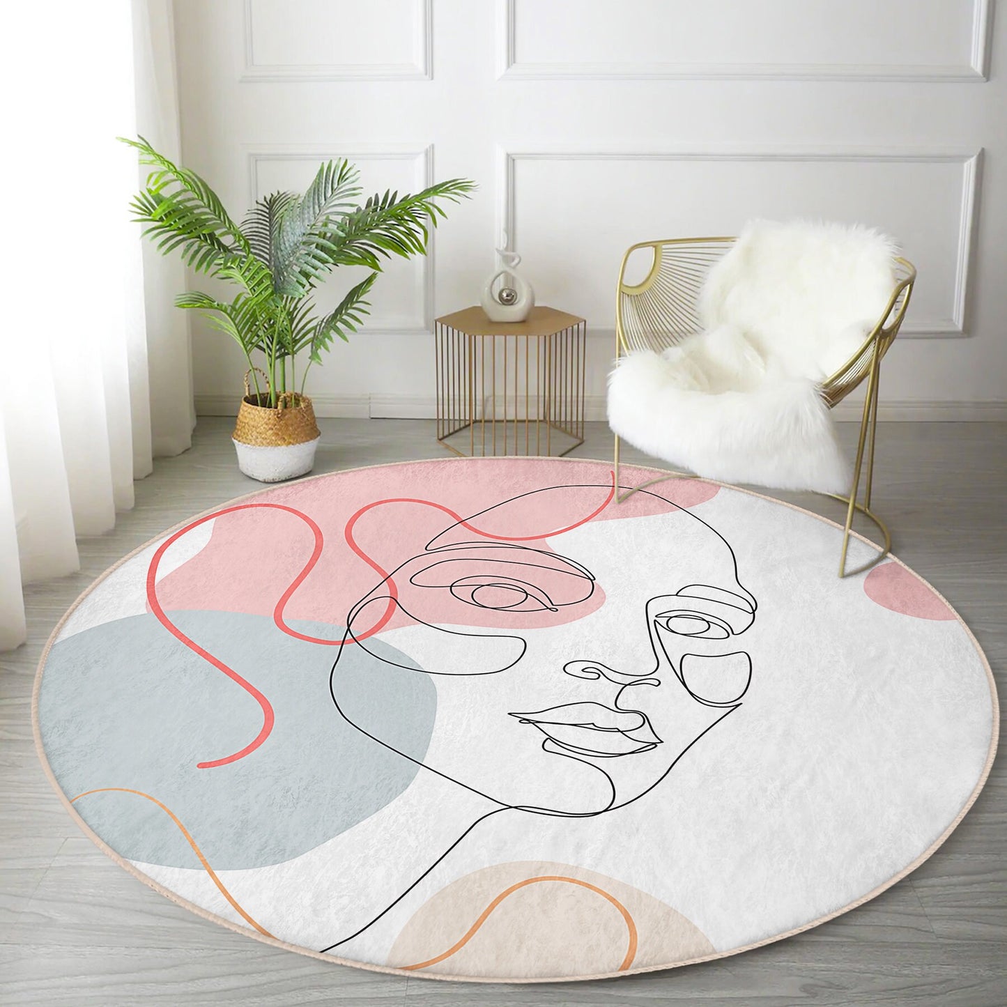 Modern living room with round abstract face art rug, gold wire chair with white fur throw, green potted plant