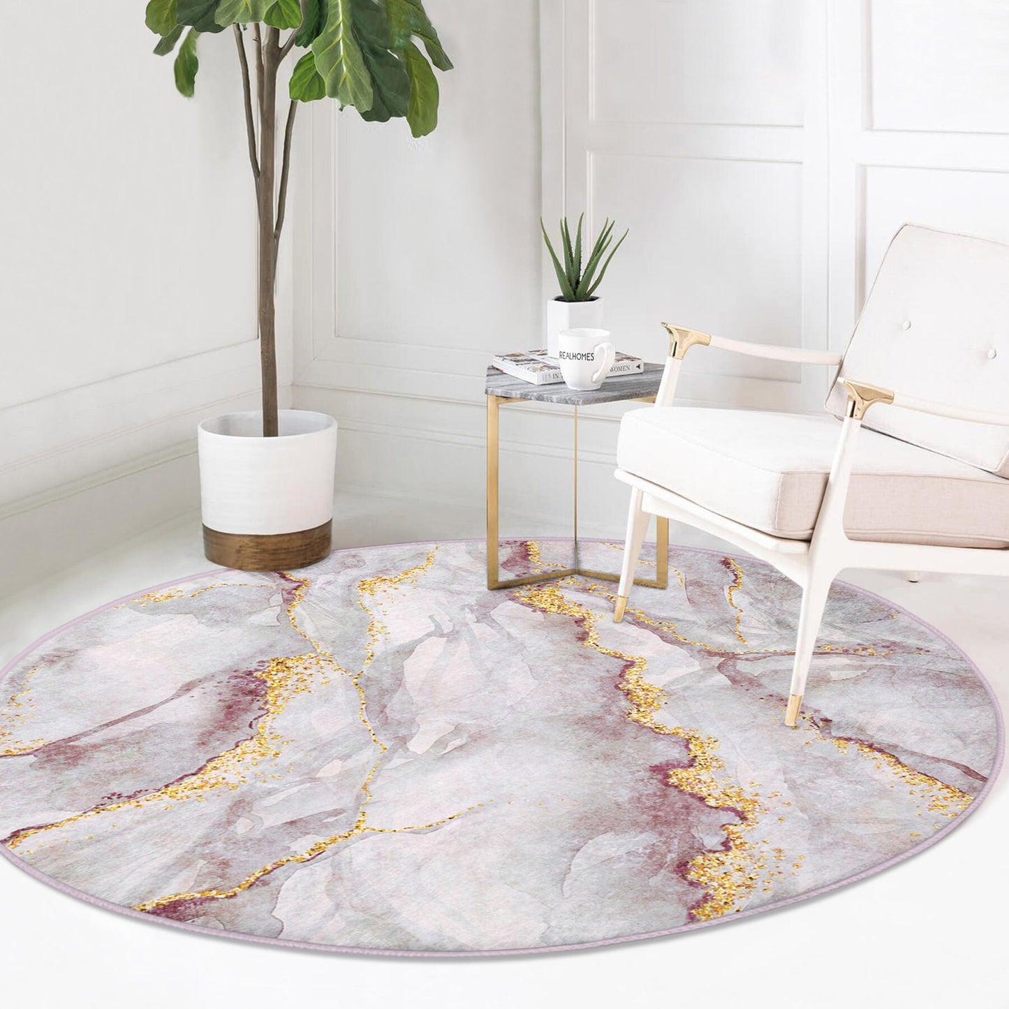 Modern living space with white armchair, gold-accented side table, tall potted plant, and round marble-patterned area rug