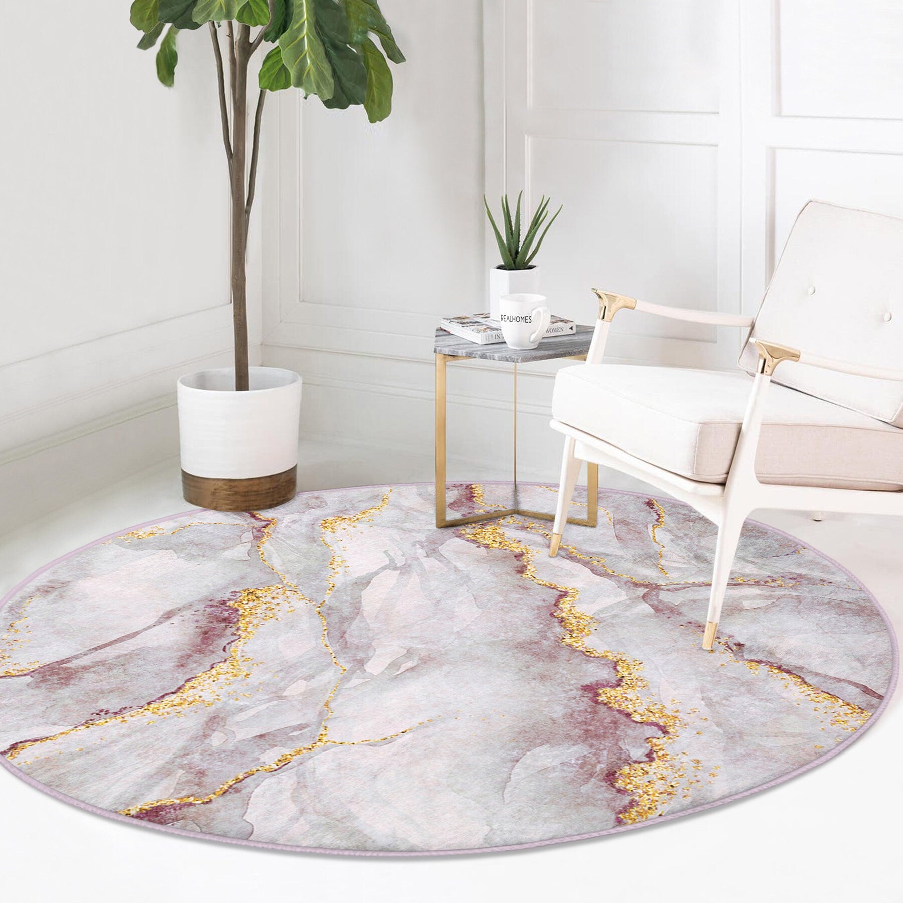 Modern living space with white armchair, gold-accented side table, tall potted plant, and round marble-patterned area rug