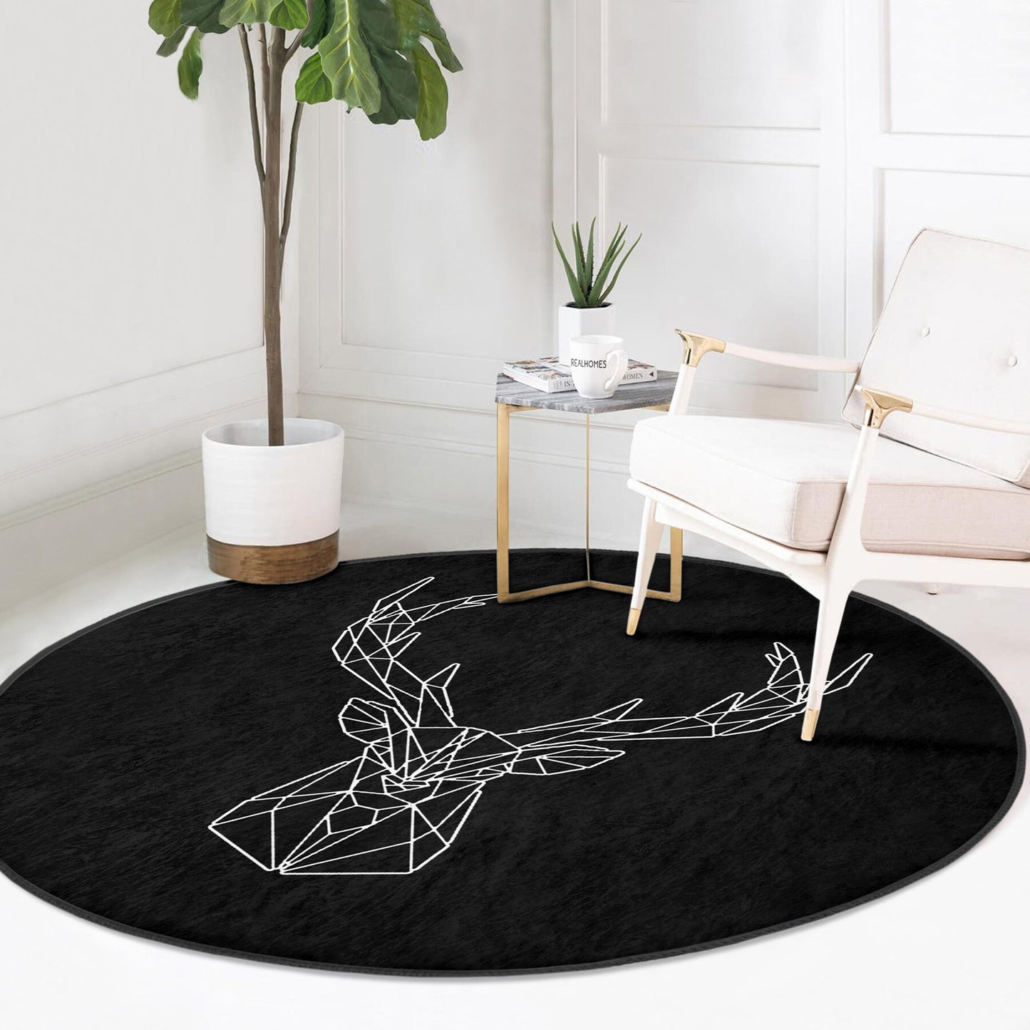 Modern living room corner with white armchair, gold side table, potted plant, and black round rug with white geometric deer design