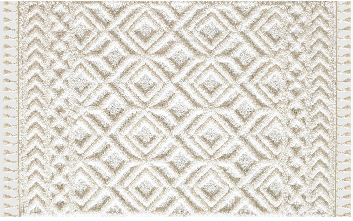 Cream white textured rug with geometric diamond and zigzag patterns and tassels on edges