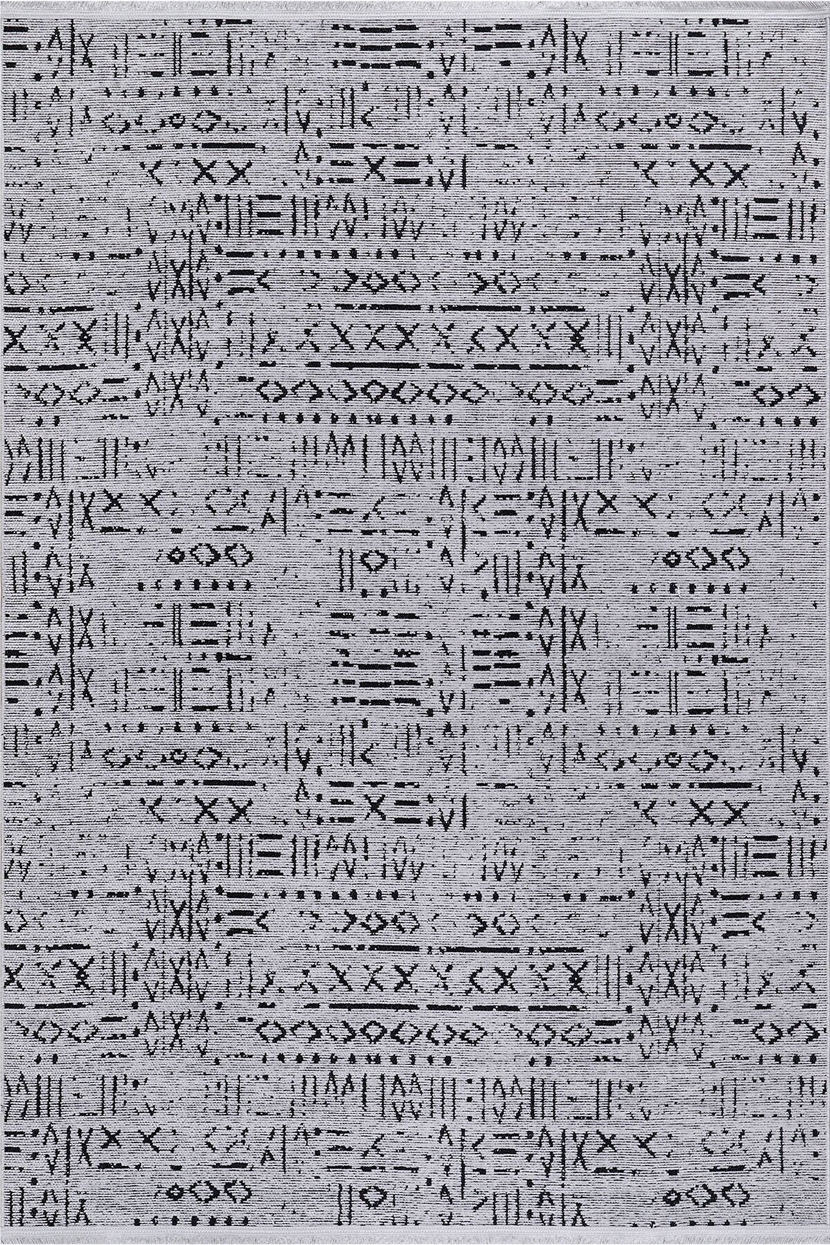 Gray rug with intricate black geometric tribal patterns in a symmetrical design