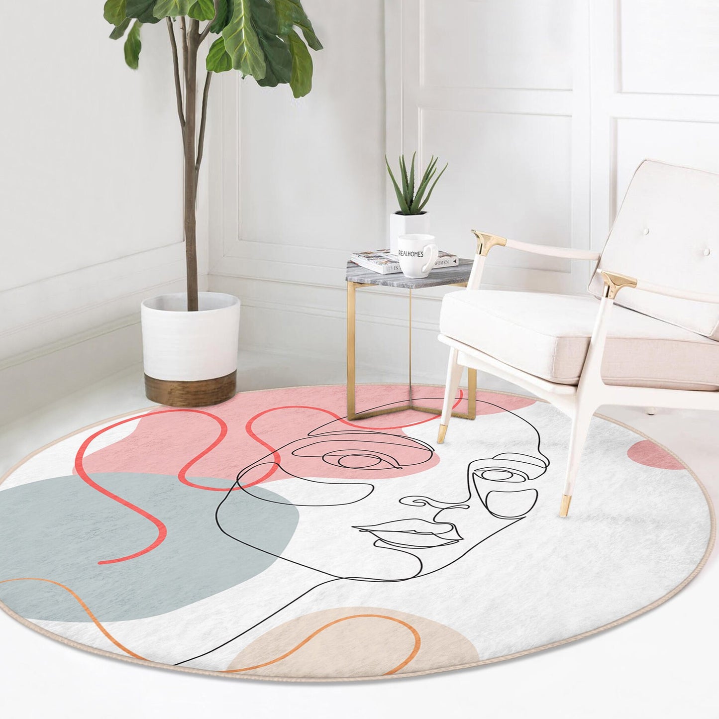 Round modern area rug with abstract female face line art in pink, blue, and beige tones in stylish living room